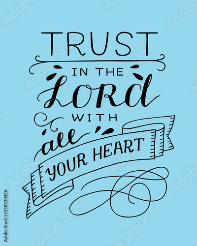 Hand lettering with bible verse Trust in the Lord with your heart on blue background.