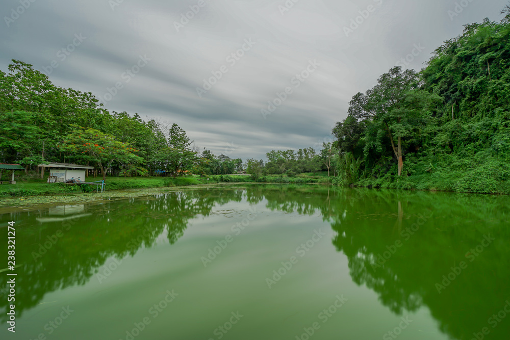 Green Mountain reflected in the lake. Chiangrai, Thailand Green Mountain reflected in the lake. Chiangrai, Thailand