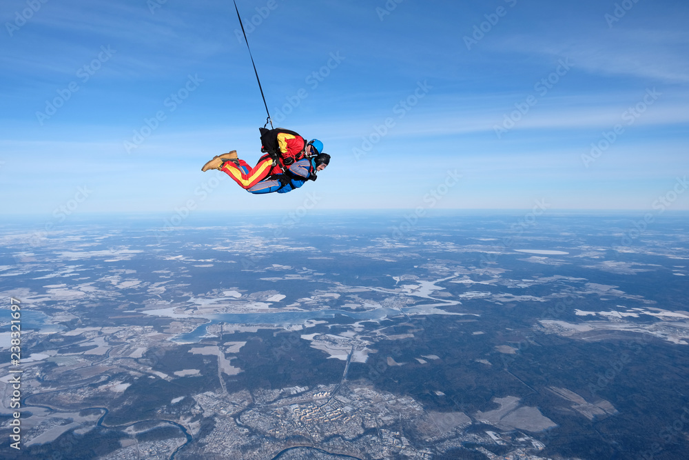 Tandem skydiving. Two happy men are in the sky. Tandem skydiving. Two happy men are in the sky.