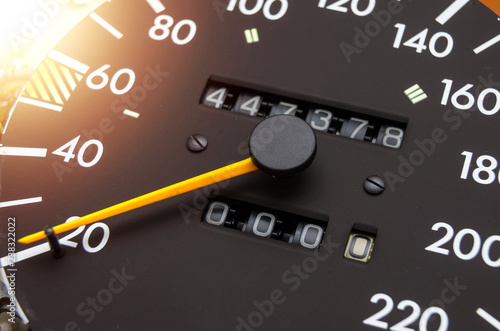 Close up shot of a speedometer in a car. Car dashboard. Dashboard details with indication lamps.Car instrument panel. Dashboard with speedometer, tachometer, odometer. Car detailing. Modern interior