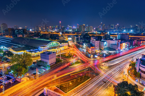 traffic at Hua Lamphong intersection and Hua Lamphong railway station at night in Bangkok, Thailand
