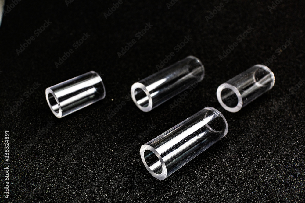 Naklejka premium transparent pipe tube on black background