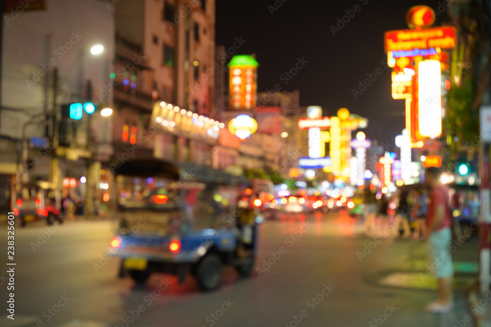 Blurred view of the streets at night in Chinatown located in Bangkok