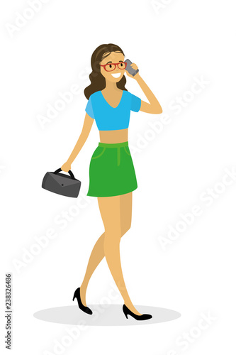 Beautiful fashionable woman walking and talking on the phone,isolated on white background
