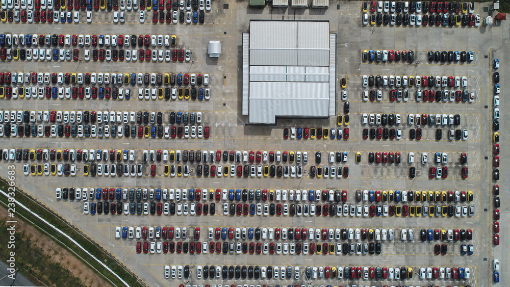 Aerial view many a lot of car park at motor manufacturing