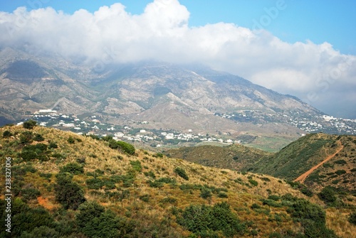 View across countryside towards the Sierra de Mijas mountains near Fuengirola, Spain. © arenaphotouk
