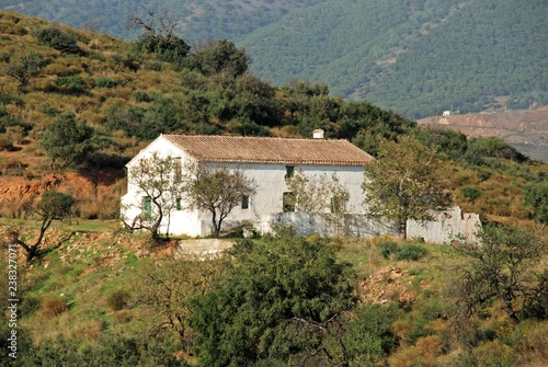 Traditional Spanish Finca in the countryside with views towards the Sierra de Mijas mountains near Fuengirola, Spain.