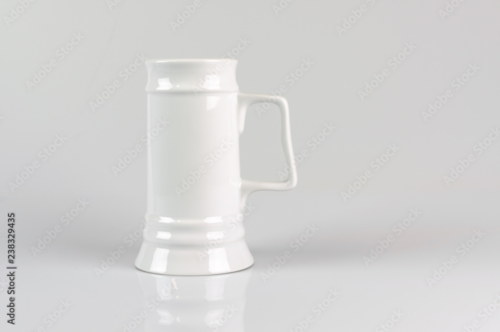Clean white Mug of beer on white grey background Clean white Mug of beer on white grey background