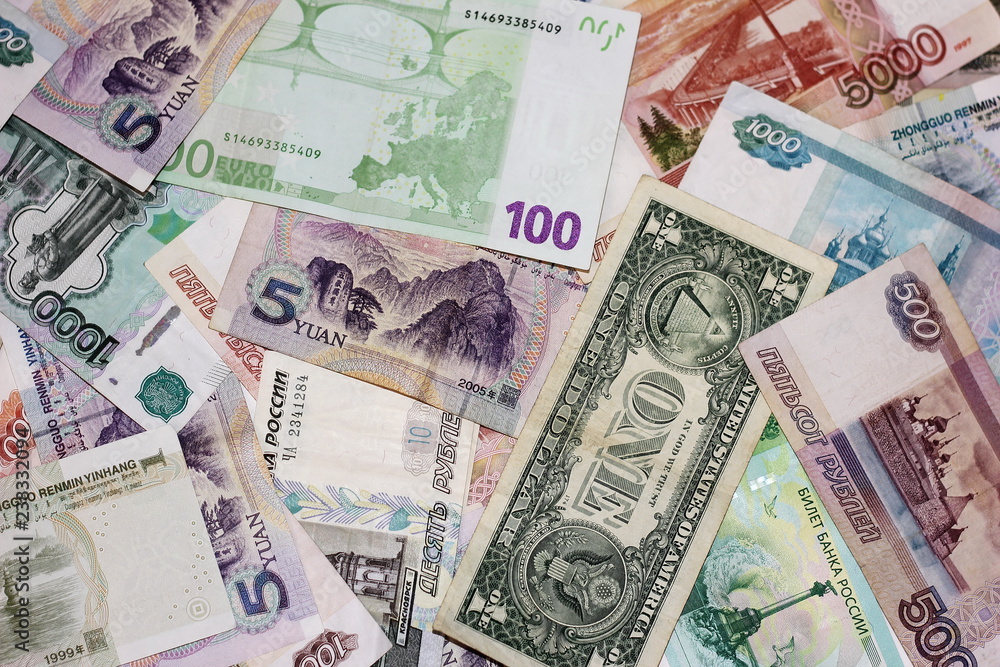 Banknotes of different countries are a bunch of alternately. Rubles, dollar, Euro, yuan. The concept of international business and tourism. Banknotes of different countries are a bunch of alternately. Rubles, dollar, Euro, yuan. The concept of international business and tourism.