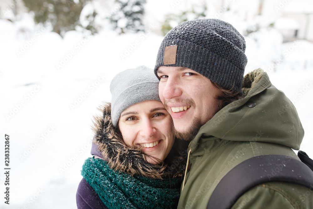 Happy Young Couple in Winter city having fun.