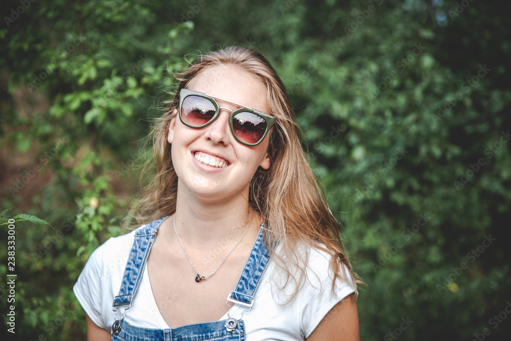 beautiful young blond woman with sunglasses in the nature summer beautiful young blond woman with sunglasses in the nature summer