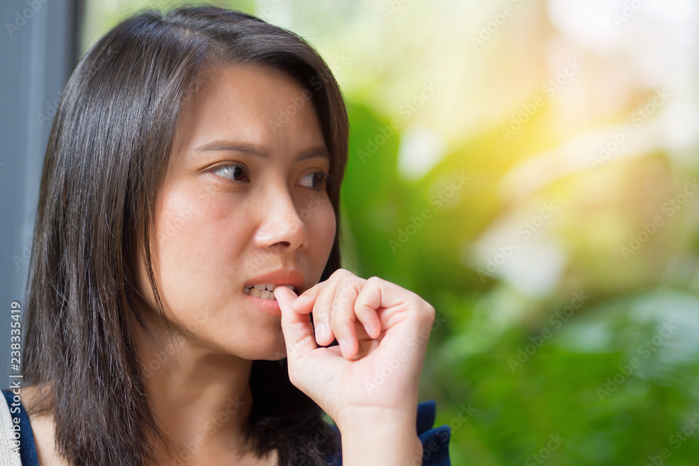 woman bite finger, girl strain and intend, confused girl woman bite finger, girl strain and intend, confused girl