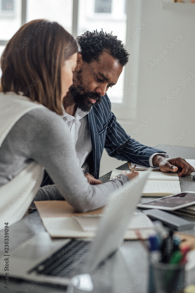 Co-Workers Discussing Co-Workers Discussing