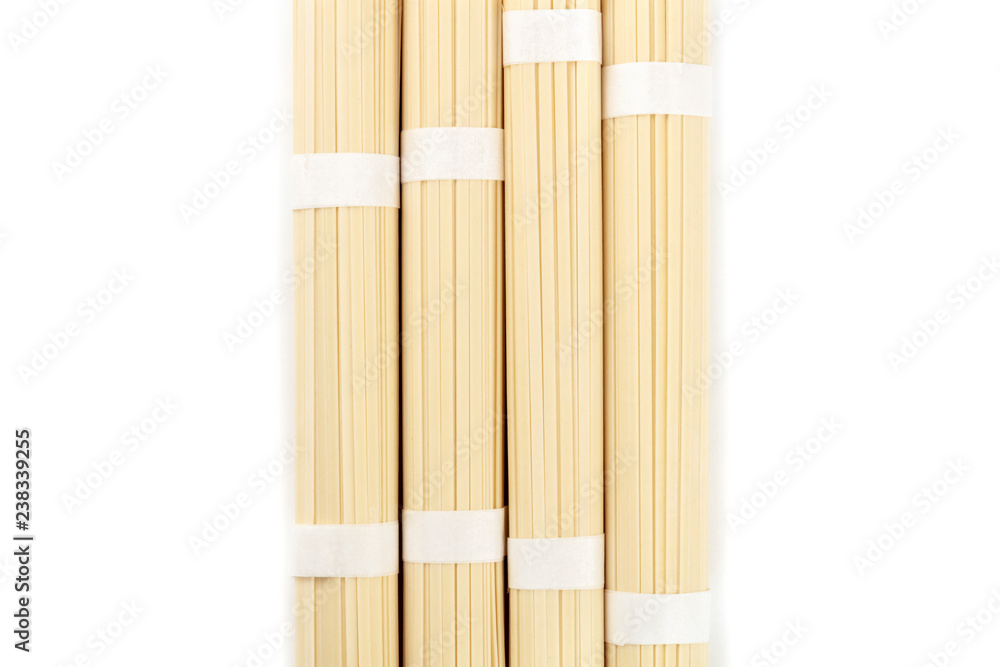 An overhead photo of udon noodles, shot from the top on a white background with copy space An overhead photo of udon noodles, shot from the top on a white background with copy space