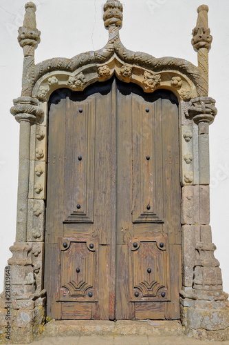 Matriz church (Nossa Senhora das Dores): details of a Manueline doorway inside the old town of Monchique, Algarve, Portugal photo