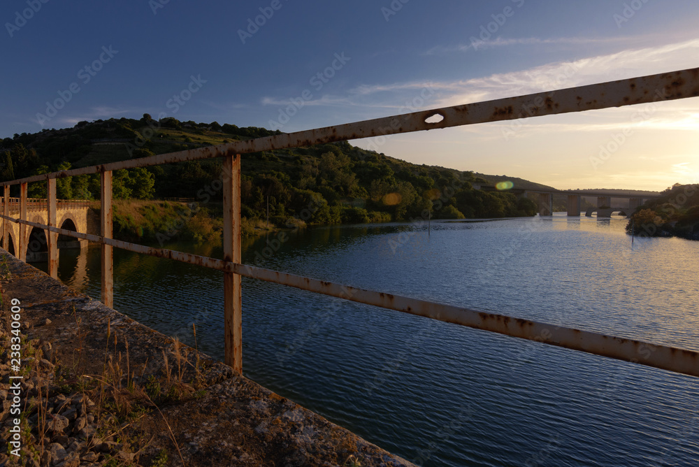View Lake Barrocus from Railway train bridge in Isili town in the historical region of Sarcidano, province of South Sardinia. View Lake Barrocus from Railway train bridge in Isili town in the historical region of Sarcidano, province of South Sardinia.