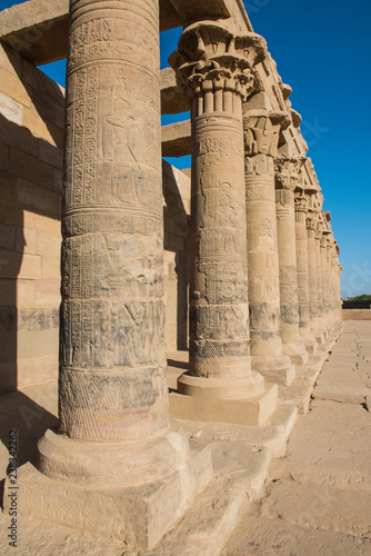 Hieroglyphic carvings on columns at an ancient egyptian temple photo