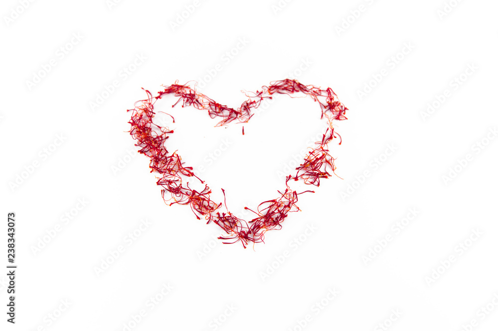 Heart made with saffron red gold of sardinia isolated on white clean background