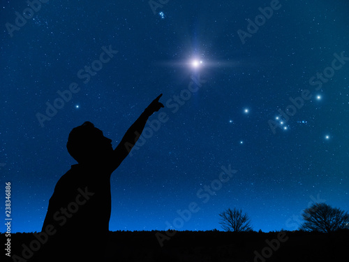 Man pointing at the starry night sky. Elements of this image are my work.