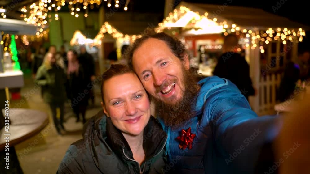 POV of couple taking selfie at traditional Christmas market, Zagreb, Croatia. POV of couple taking selfie at traditional Christmas market, Zagreb, Croatia.