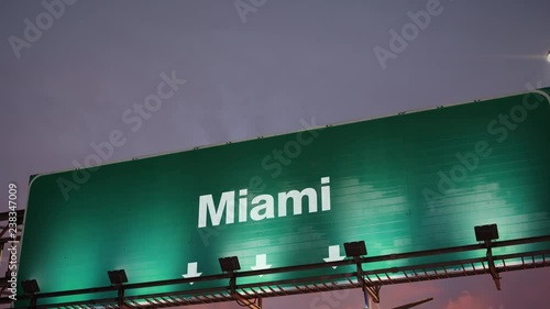 Airplane Landing Miami during a wonderful sunrise photo