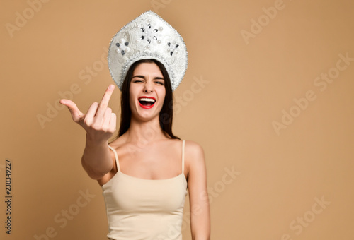 Billede på lærred Crazy happiness woman showing fuck sign but not seriously