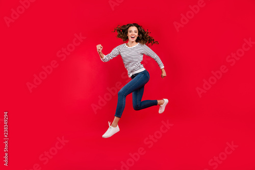 Full length size body photo of fly high attractive beautiful she her girl want to be in time for black friday sale discount wearing white casual sweater on red vivid bright background