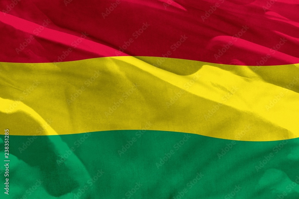 Waving Bolivia flag for using as texture or background, the flag is fluttering on the wind Waving Bolivia flag for using as texture or background, the flag is fluttering on the wind