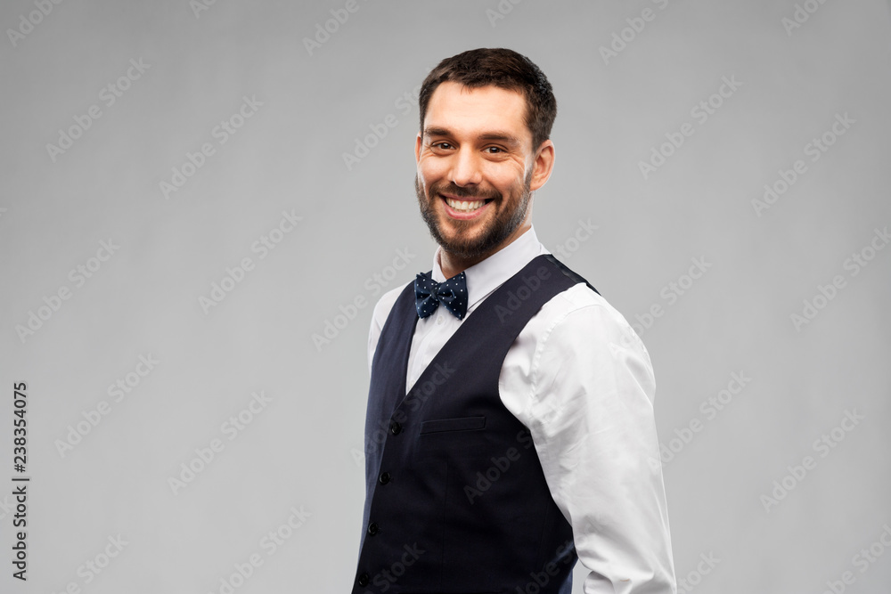 people concept - happy man in party clothes over grey background people concept - happy man in party clothes over grey background