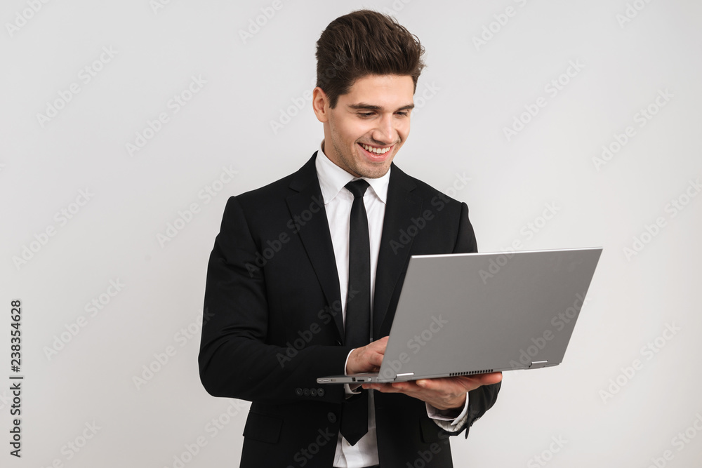 Smiling business man wearing suit standing Smiling business man wearing suit standing