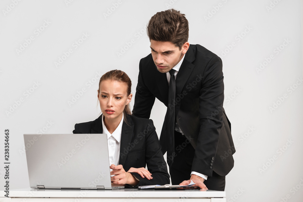 Confident young business couple Confident young business couple