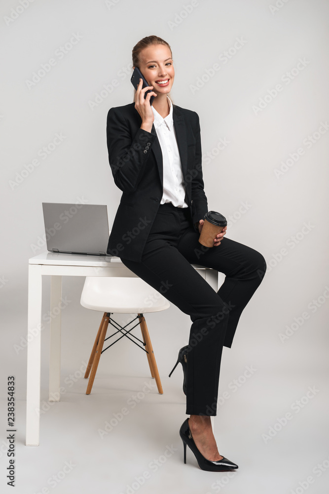 Smiling young business woman wearing suit Smiling young business woman wearing suit