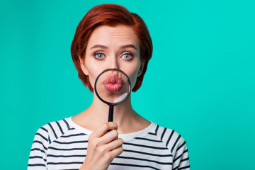 Close up studio photo portrait of cute lovely astonished amazed beautiful person she her holding magnifier send air kiss you camera wearing casual apparel isolated on vivid teal background copyspace