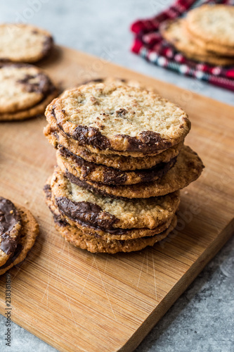 Classic Swedish Oatmeal Cookies with Chocolate on Wooden Board.