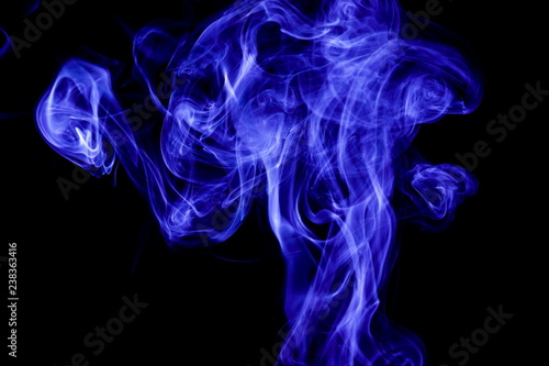 Blue smoke on black background