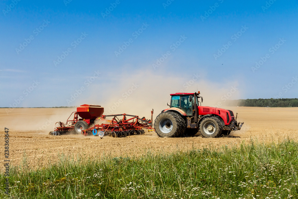 Tractor on a field. Belarus Tractor on a field. Belarus