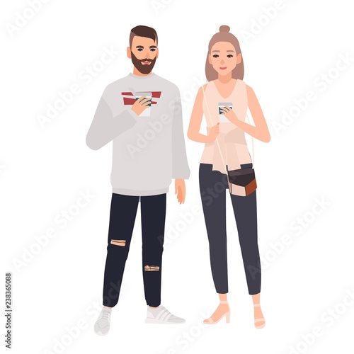 Smiling young man and woman dressed in stylish clothes standing together and drinking coffee. Funny cartoon characters isolated on white background. Colorful vector illustration in flat style.