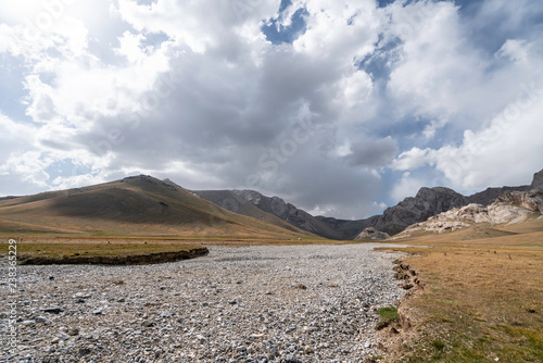 Yurt at a dry river near Chatyr Kul lake in Kyrgyzstan photo