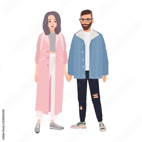Pair of hipster man and woman dressed in fashionable clothes standing together and holding hands. Stylish romantic couple. Cartoon characters isolated on white background. Flat vector illustration.