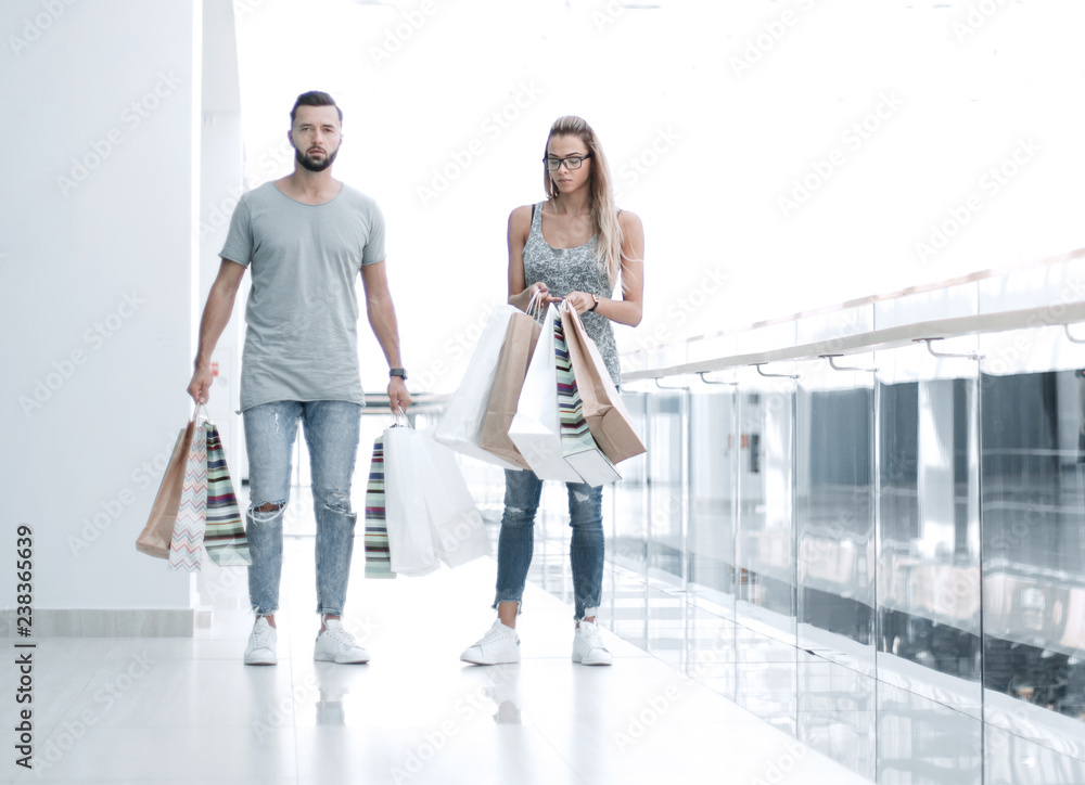 young couple with shopping bags young couple with shopping bags