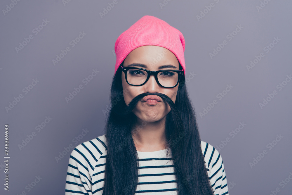 Close-up portrait of nice cute lovely attractive adorable winsome cheerful childish straight-haired girl wearing striped pullover making mustache with curl isolated on grey gray pastel background Close-up portrait of nice cute lovely attractive adorable winsome cheerful childish straight-haired girl wearing striped pullover making mustache with curl isolated on grey gray pastel background
