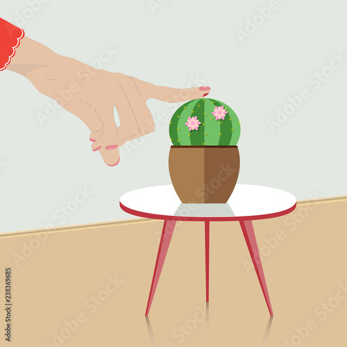 Female hand pricked  on cactus thorn