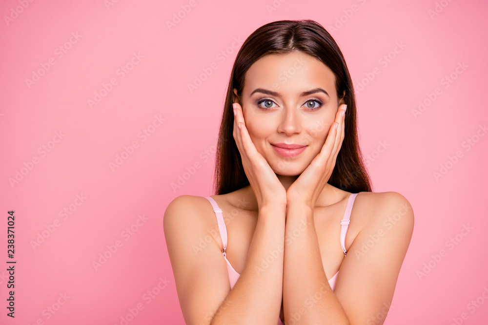 Close up portrait of beautiful cute gentle trying scrub effect touching  skin with arms her she young girl wearing pale pink bra isolated on rose  background Photos