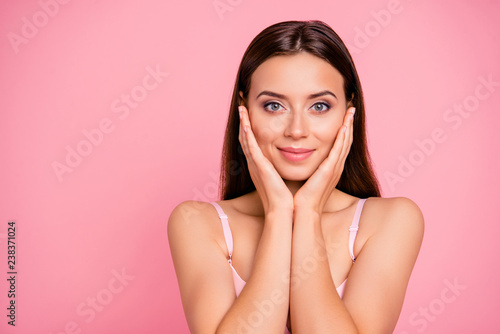 Close up portrait of beautiful cute gentle trying scrub effect touching skin with arms her she young girl wearing pale pink bra isolated on rose background