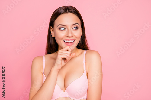 Close up portrait of wondered cute gorgeous attractive dreamy looking to sale with arm on chin her she lady girl wearing pale pink bra isolated on rose background