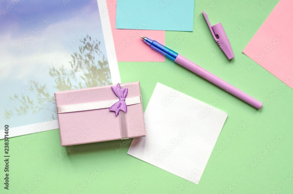 A small gift of pale lilac. Office, stickers on a green background. A small gift of pale lilac. Office, stickers on a green background.
