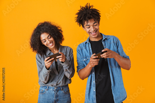 Cheerful young african couple standing