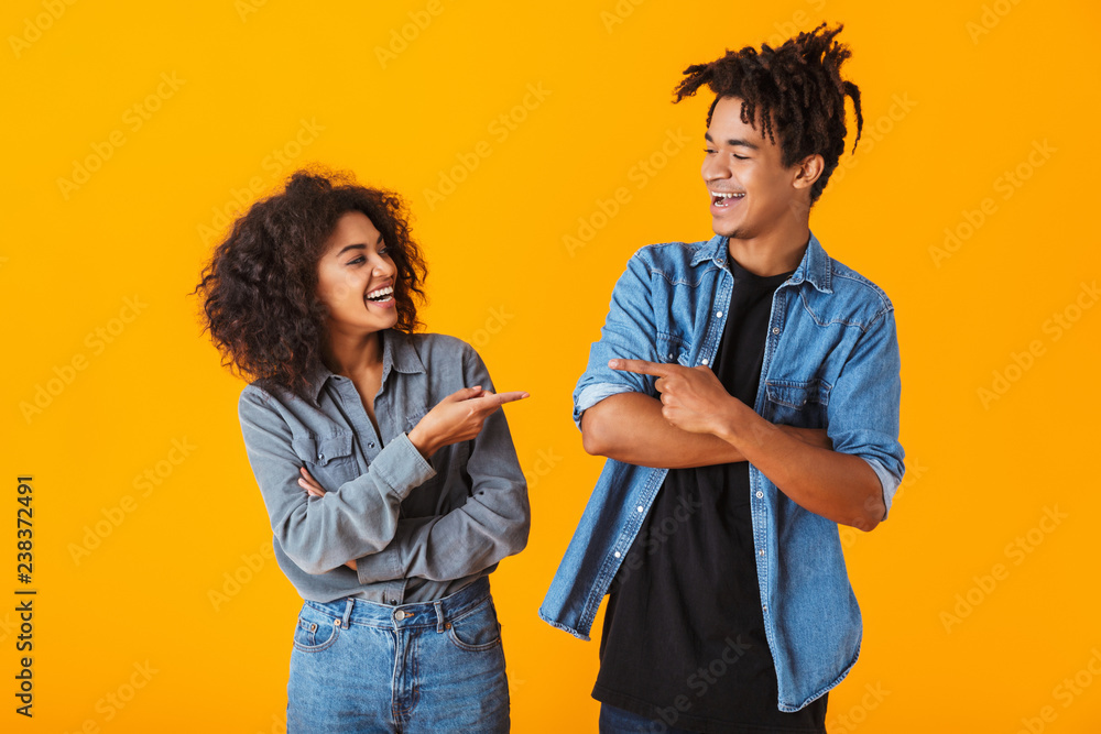 Cheerful young african couple standing Cheerful young african couple standing