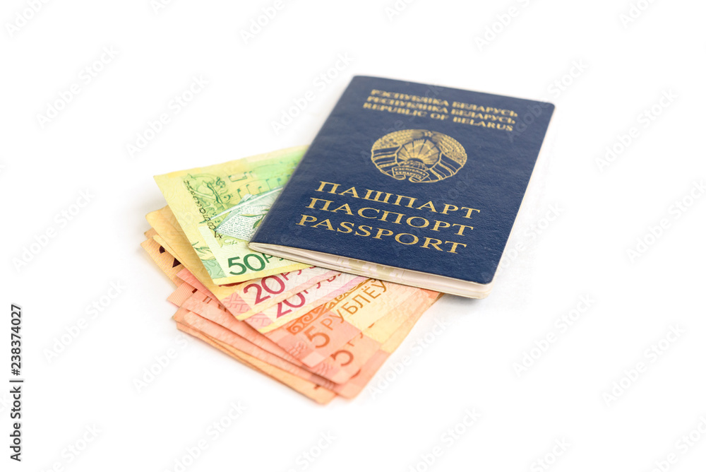 Belarusian passport and new banknotes in the Republic of Belarus isolated on white background. Belarusian passport and new banknotes in the Republic of Belarus isolated on white background.