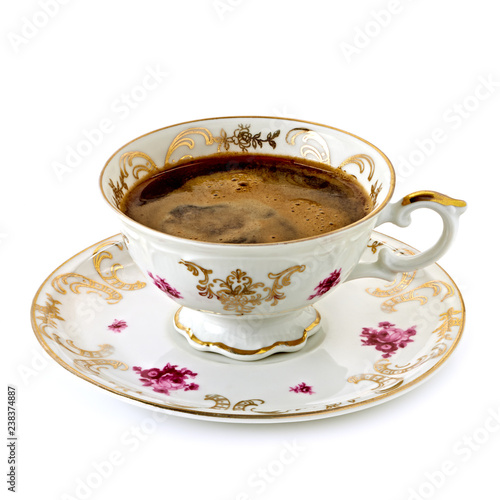 Turkish coffee in antique porcelain cup on white background 